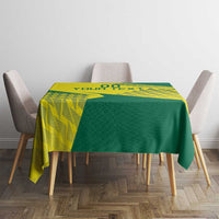 Green and yellow square tablecloth with geometric volleyball print on dining table