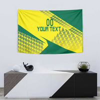 Yellow and green volleyball tapestry with geometric shapes and '00 YOUR TEXT' on wall.