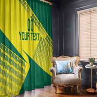 Hanging window curtain with yellow-and-green geometric design and custom text, room view
