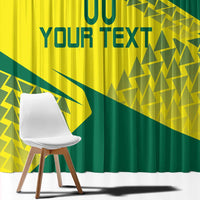 Close-up window curtain showing yellow base, dark green diagonal shapes, and custom text