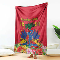 Red Haiti independence blanket draped with palm tree, swords, and floral scene
