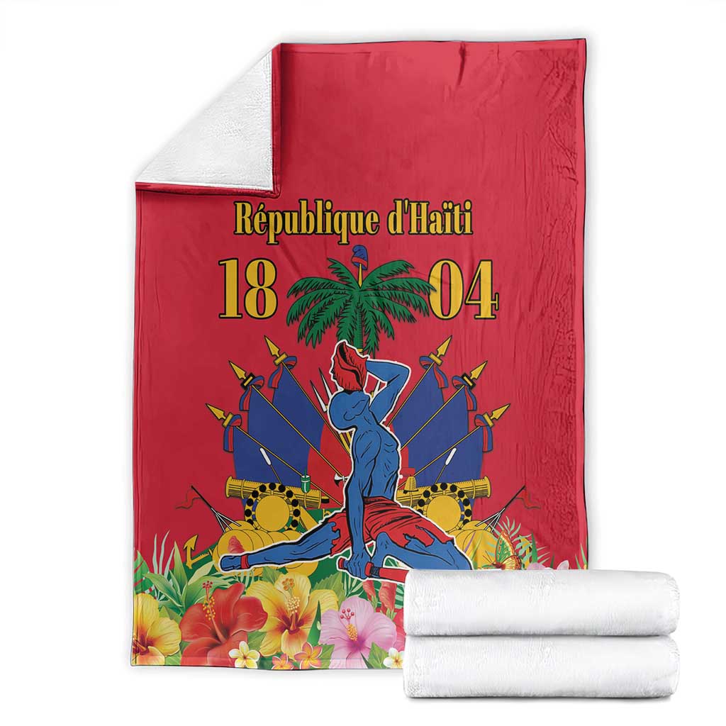 Red Haiti independence blanket folded with palm tree, swords, and floral border