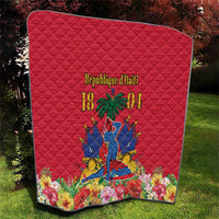 Red quilt with Haiti independence graphic and floral border