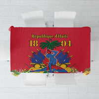 Red printed Haiti-themed tablecloth with central coat of arms and figures