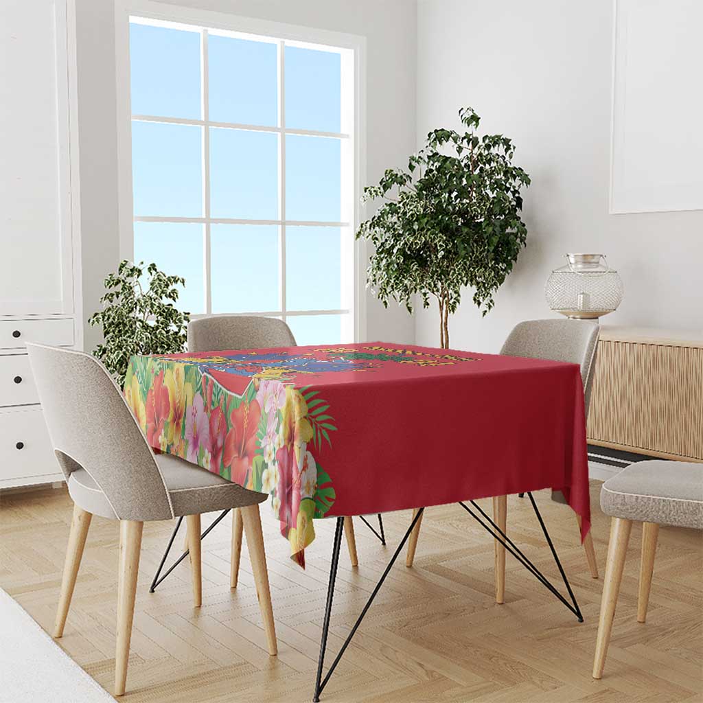 Red tablecloth with colorful tropical floral border over dining table