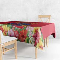 Red tablecloth with large tropical flower print and multicolor edge
