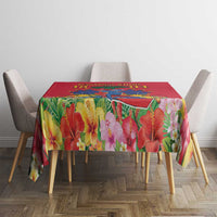 Red tablecloth with vibrant tropical flower design on dining table