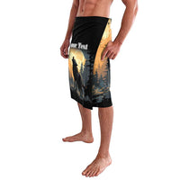 Black graphic swim trunks with howling wolf and moonlit pine scene