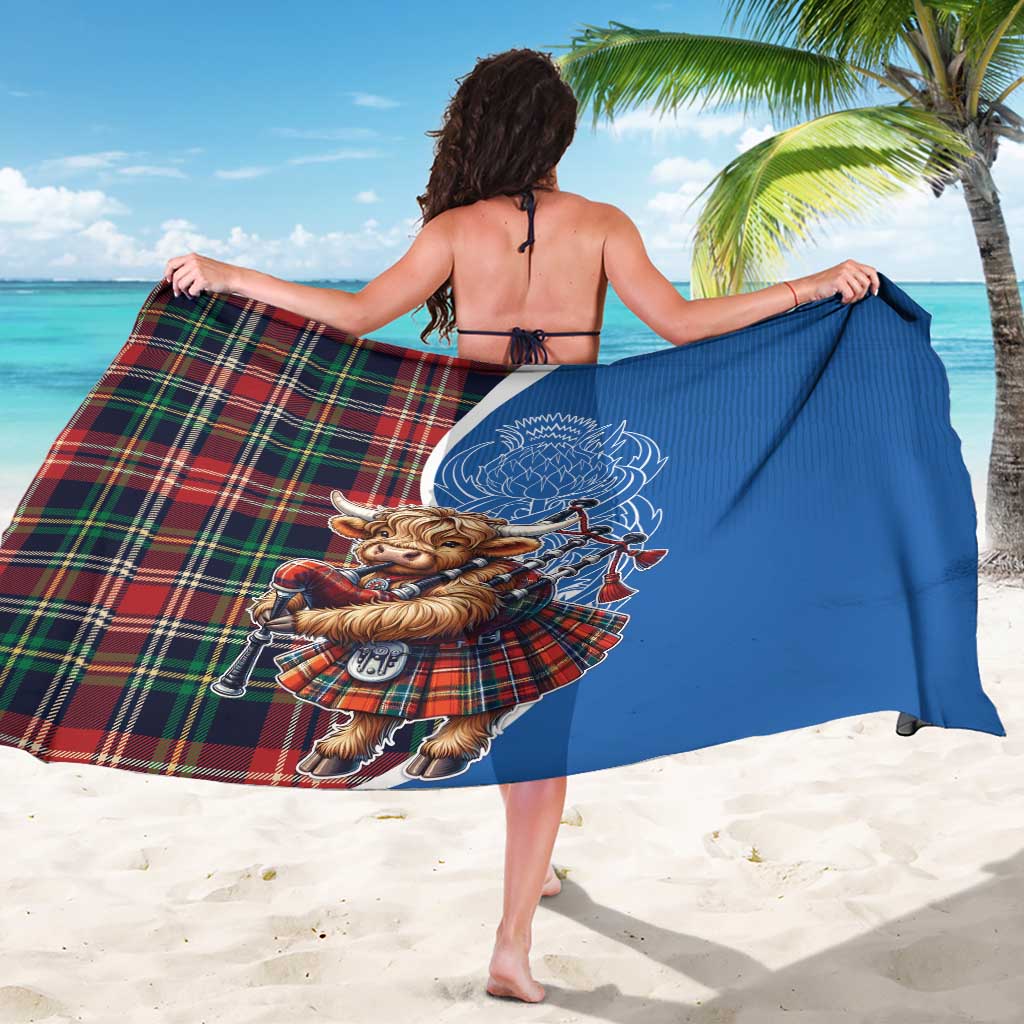 Blue sarong with Highland cow bagpipes graphic, red-green tartan edge