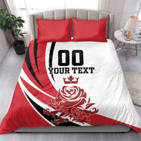 Red and white duvet cover set with black text and crest graphic, with two red pillow shams