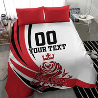 Red and white bedding set with black '00 YOUR TEXT' print and crest, paired with red shams