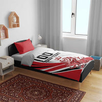 Red and white duvet cover set with black '00 YOUR TEXT' and rose-crest design, two red shams