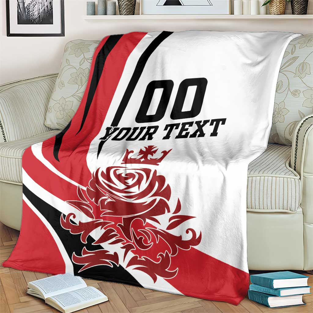 Custom England football blanket draped on a couch with red rose design and 00 YOUR TEXT