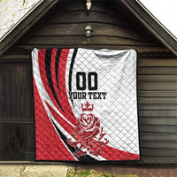 Quilted blanket with red, white, and black diagonal stripes and '100 YOUR TEXT' crest