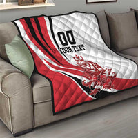 Quilted football-style blanket with red, white, and black diagonal stripes and custom text