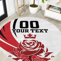 Close view of round rug showing red floral rose and crown with black "YOUR TEXT"