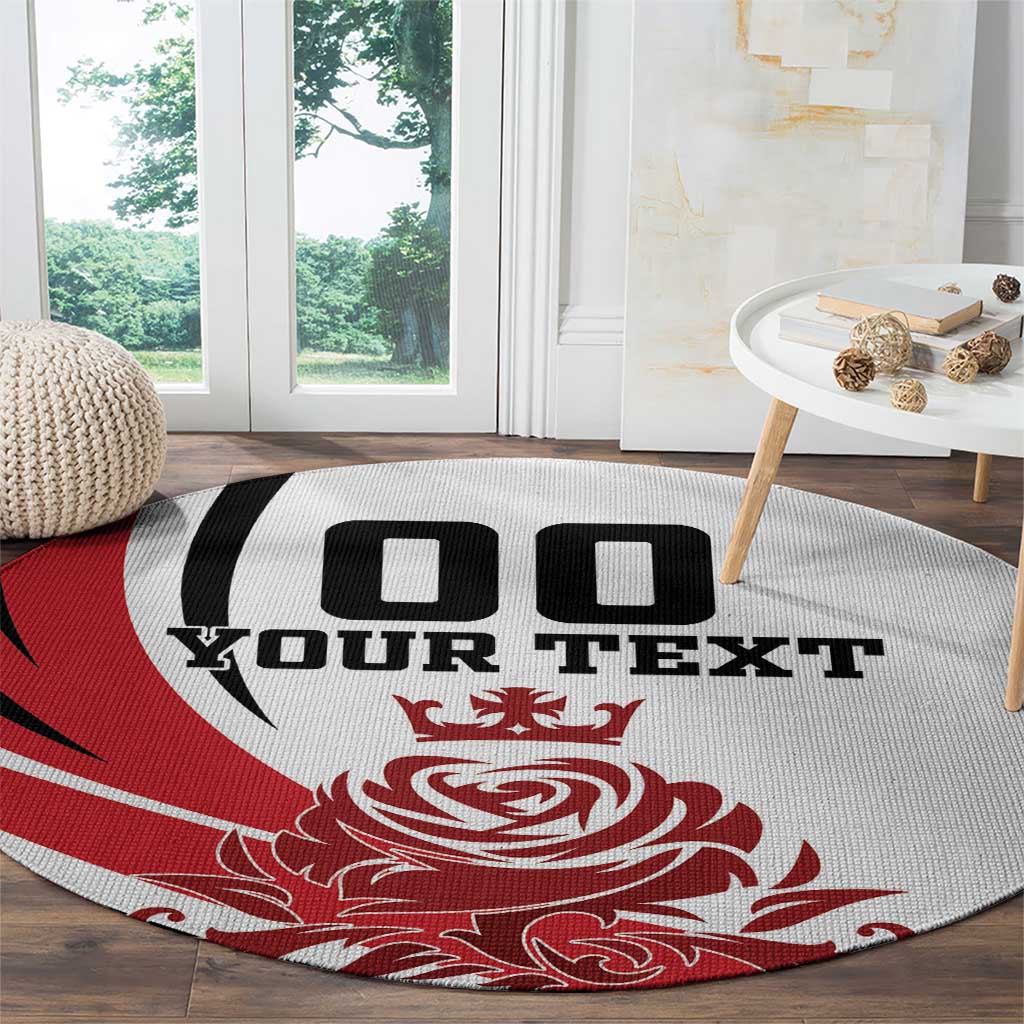 Round rug with red design and white field, black "YOUR TEXT" and crest