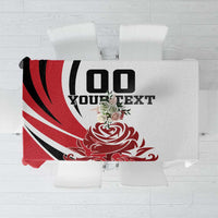 Red, white and black football-themed tablecloth with bold crest graphic