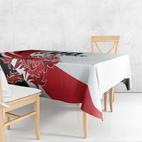 Red and white football tablecloth draped over square table with corner drop