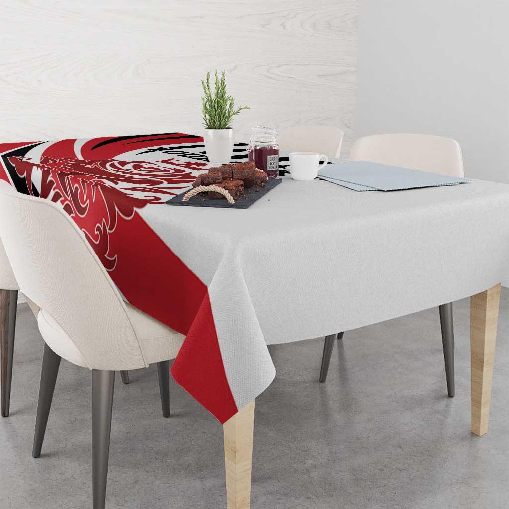 Red and white football tablecloth on dining table with small centerpiece items