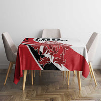 Red, white and black tablecloth on dining table with crest and text