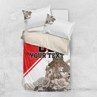Red-and-white bedding set with rose and leaf pillow covers and “DO YOUR TEXT” design