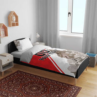 Red and white bedding set with floral accents, custom text panel, and clock tower print