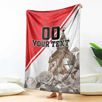 Red and white personalized blanket with Big Ben tower, roses, and “YOUR TEXT” design