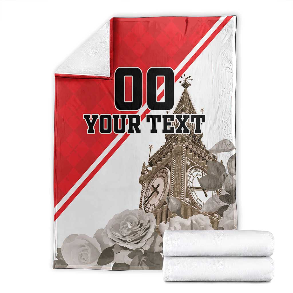 Folded red and white custom blanket with Big Ben, roses, and “YOUR TEXT” print