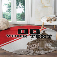 Round area rug with red border stripes, 'YOUR TEXT' and Big Ben illustration with roses