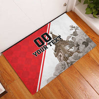 Red and white rubber doormat featuring Big Ben, roses, and '00 YOUR TEXT' lettering