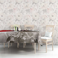 White tablecloth with gray rose and leaf print and red edge stripe, draped on table