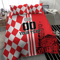 Red and white duvet with checker pattern, vertical stripes, and city skyline graphic