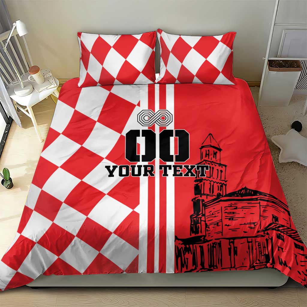 Red and white bedding set featuring two pillows and checkerboard panel with skyline art