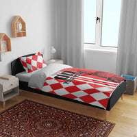 Red and white checkerboard duvet and pillow set on bed, skyline and vertical stripe print