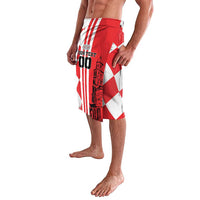 Red and white checkerboard swim shorts with elastic waistband and side graphic panel