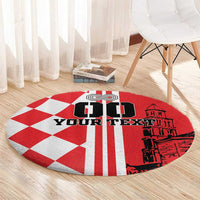 Red and white round checkerboard rug with black custom text and building graphic