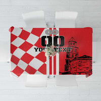 Red and white checkered tablecloth with city skyline and nautical emblem center