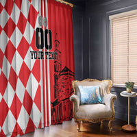 Curtains beside armchair: red-and-white diamond panel and red skyline panel.