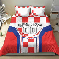 Red, white and blue bedding set with two pillows, checkerboard accents and 'YOUR TEXT' crest.
