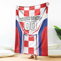 Red, white, and blue checkerboard blanket with 'YOUR TEXT' and large '00' on front