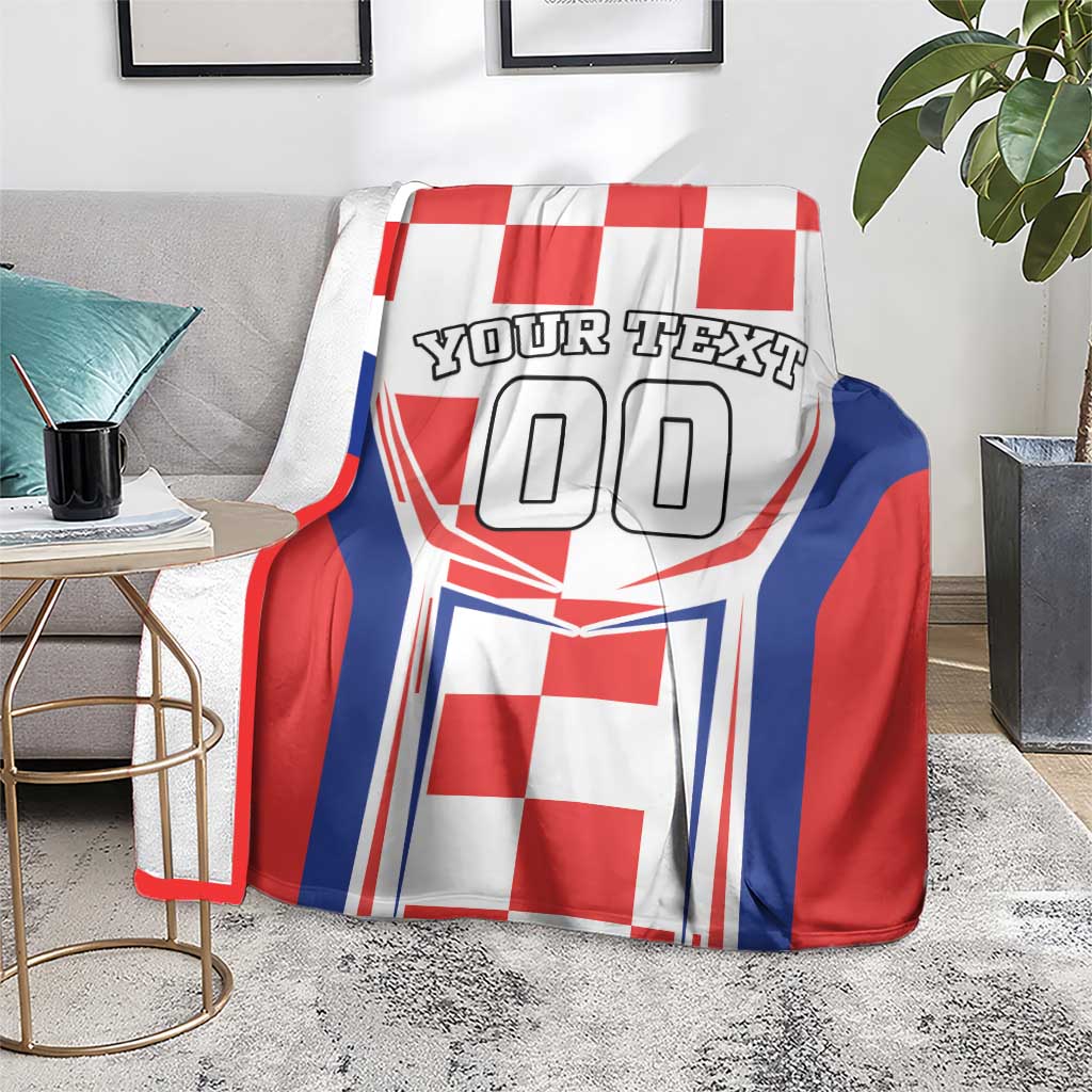 Red, white, and blue checkerboard blanket on sofa; 'YOUR TEXT' and '00' graphic