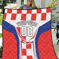 Custom quilt with red and blue checker blocks, white crest, “YOUR TEXT 00”
