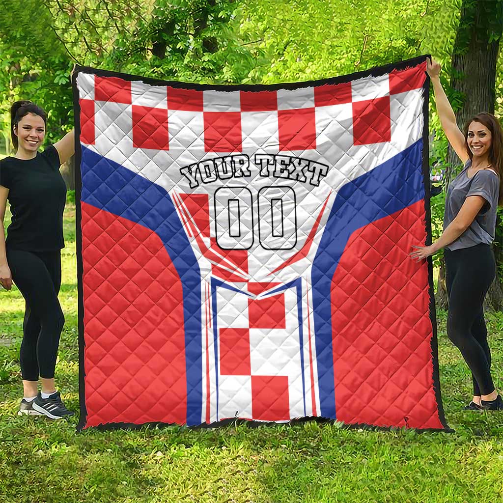 Large quilt blanket with red and blue panels, white crest, “YOUR TEXT 00”