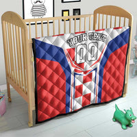 Custom quilt blanket for crib with red, white, and blue crest “YOUR TEXT 00”