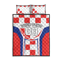 Quilt bed set with red, white, and blue quilted panels; shows custom text and 00
