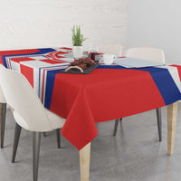 Red, white, and blue checkerboard tablecloth draped on a dining table
