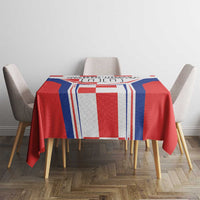Red tablecloth with blue and white striped border and red-white blocks