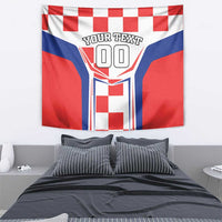 Red, white, and blue checkerboard tapestry with central shield graphic and large outlined numbers