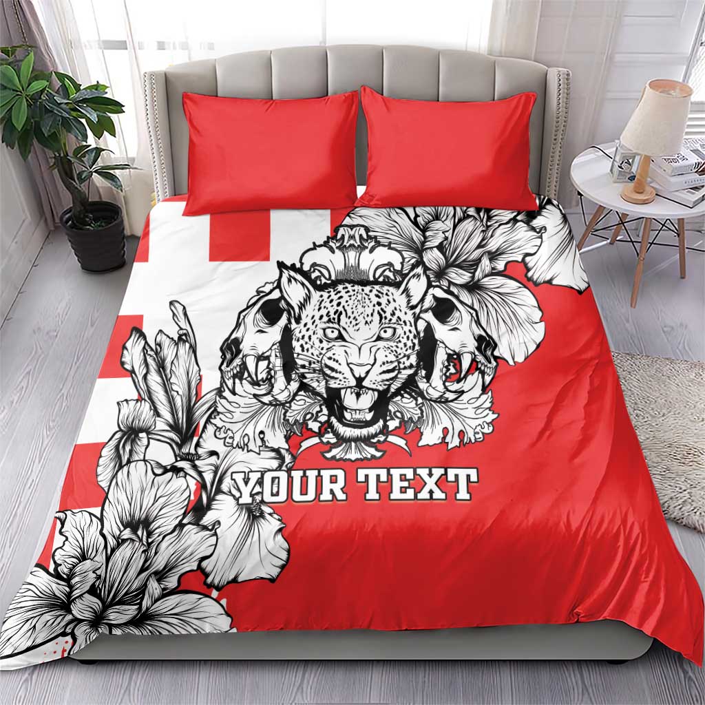 Red bedding set with leopard heads center graphic, black-and-white floral accents, and two red pillows
